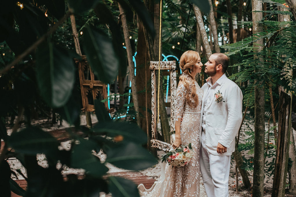 Couple in an enchanting garden setting with fairy lights